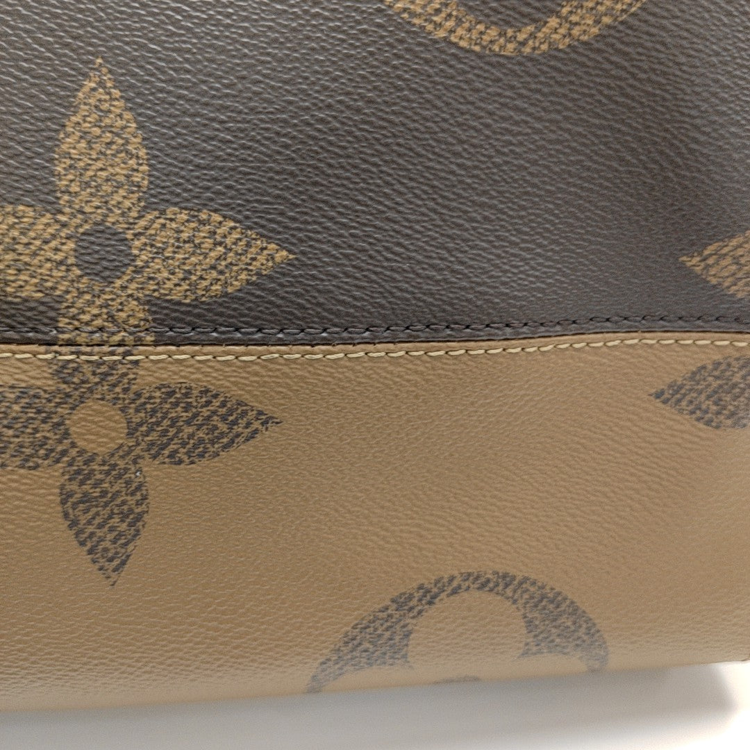 ONTHEGO GM Monogram Coated Canvas Brown
