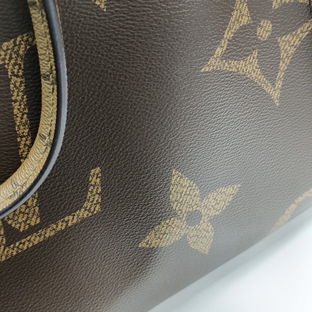 ONTHEGO MM Monogram Coated Canvas Brown