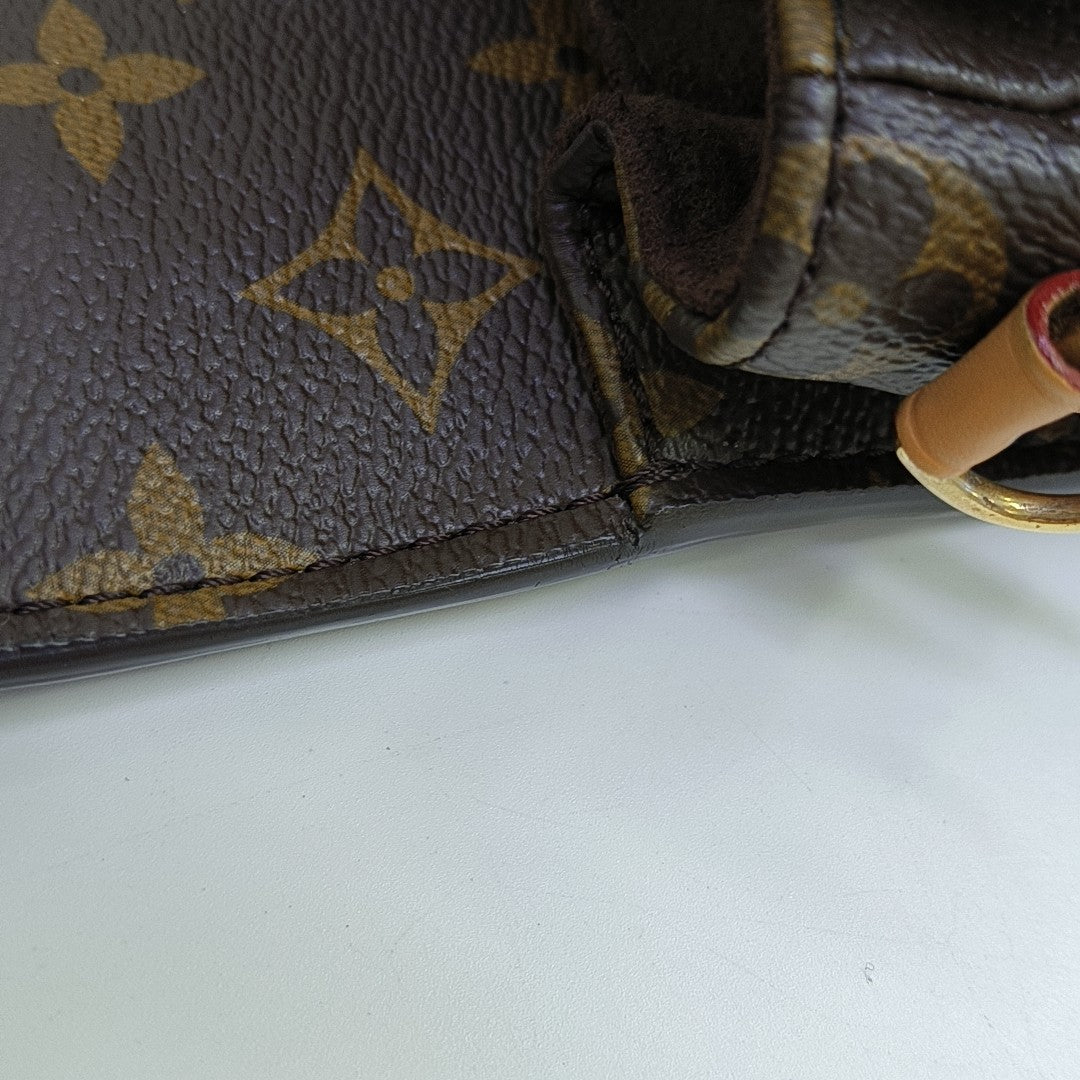 MÉTIS EAST WEST Monogram Coated Canvas Brown