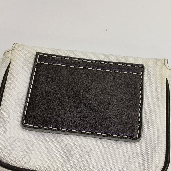 Monogram Coated Canvas Clutch White