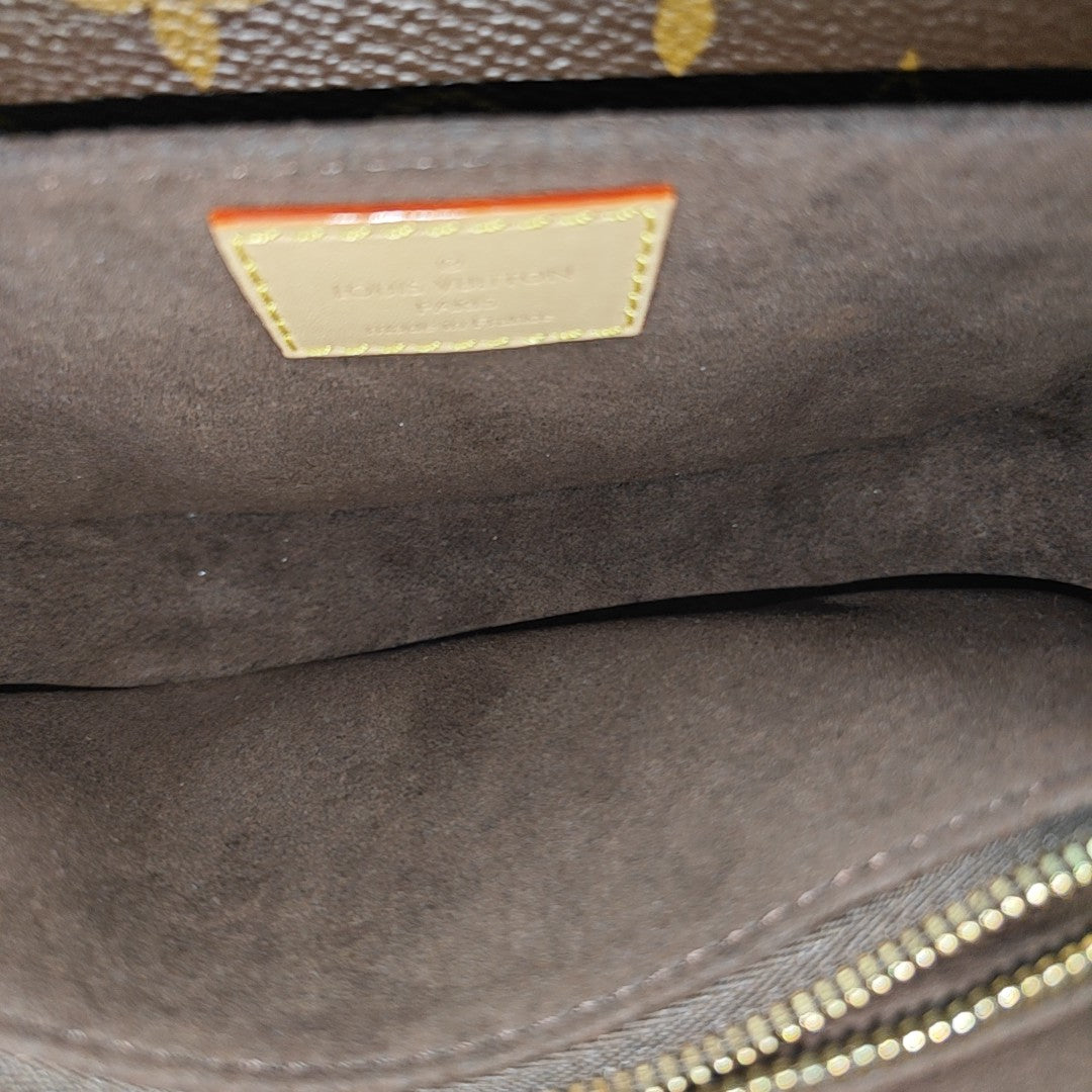MÉTIS EAST WEST Monogram Coated Canvas Brown