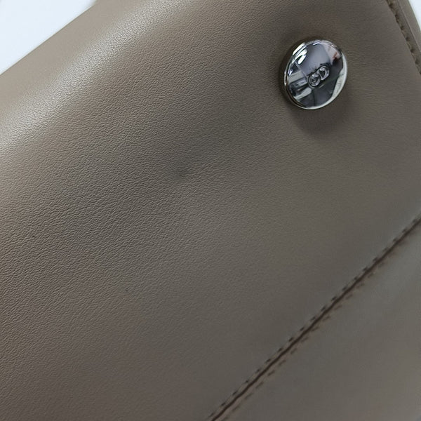 Christian Addict Calfskin Beige