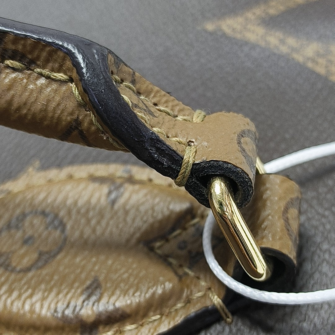 ONTHEGO MM Monogram Coated Canvas Brown