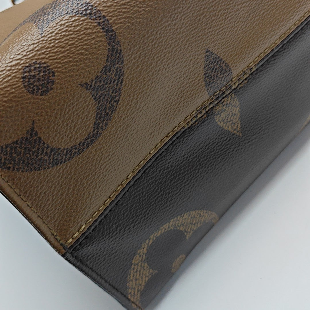 ONTHEGO MM Monogram Coated Canvas Brown