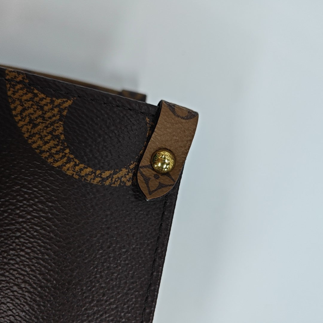 ONTHEGO MM Monogram Coated Canvas Brown