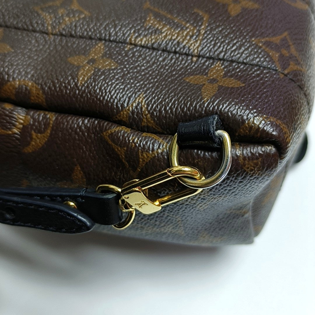 Authenticated pre-owned  PALM SPRINGS Mini Monogram Coated Canvas Brown - Backpack at Looply