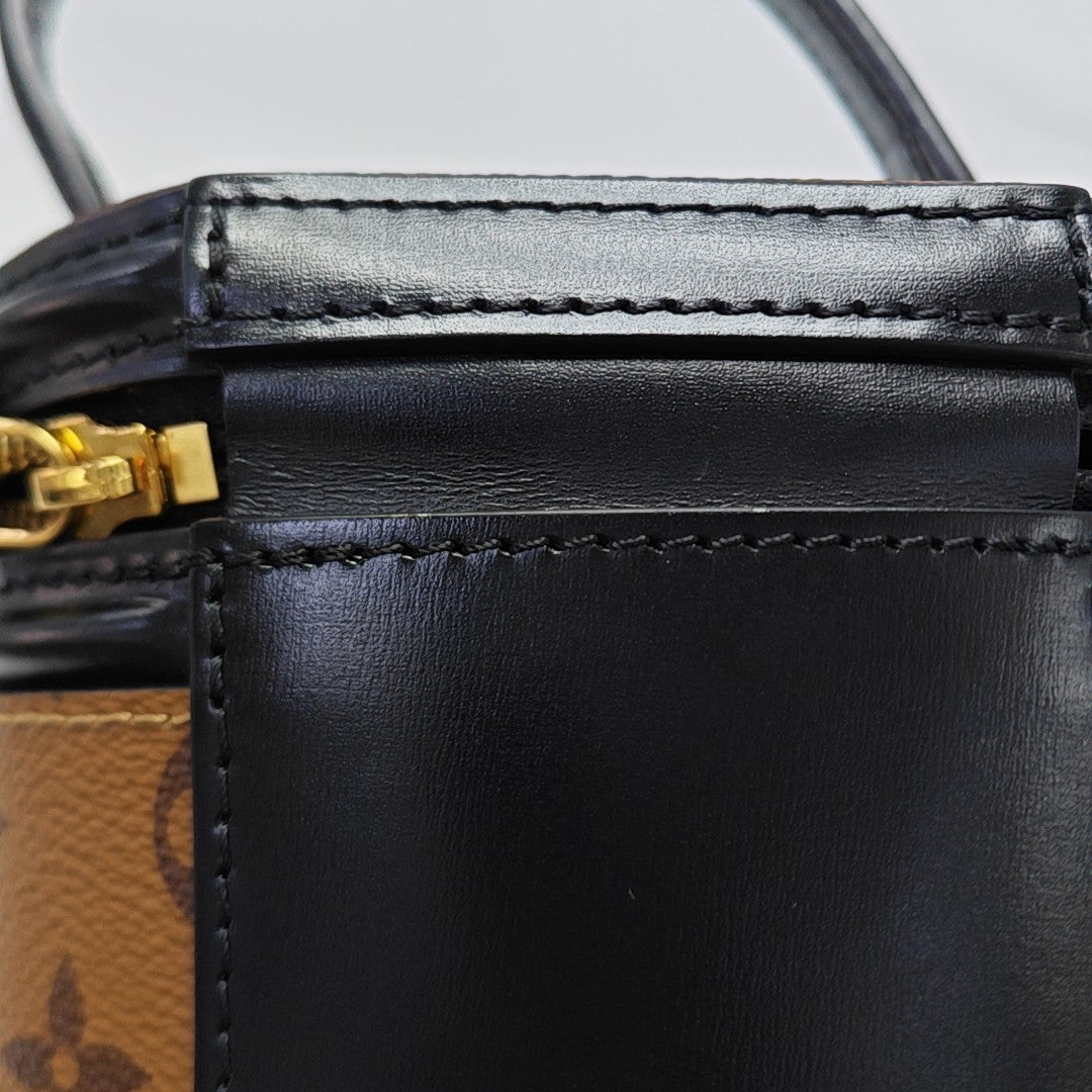 CANNES PM Monogram Coated Canvas Brown