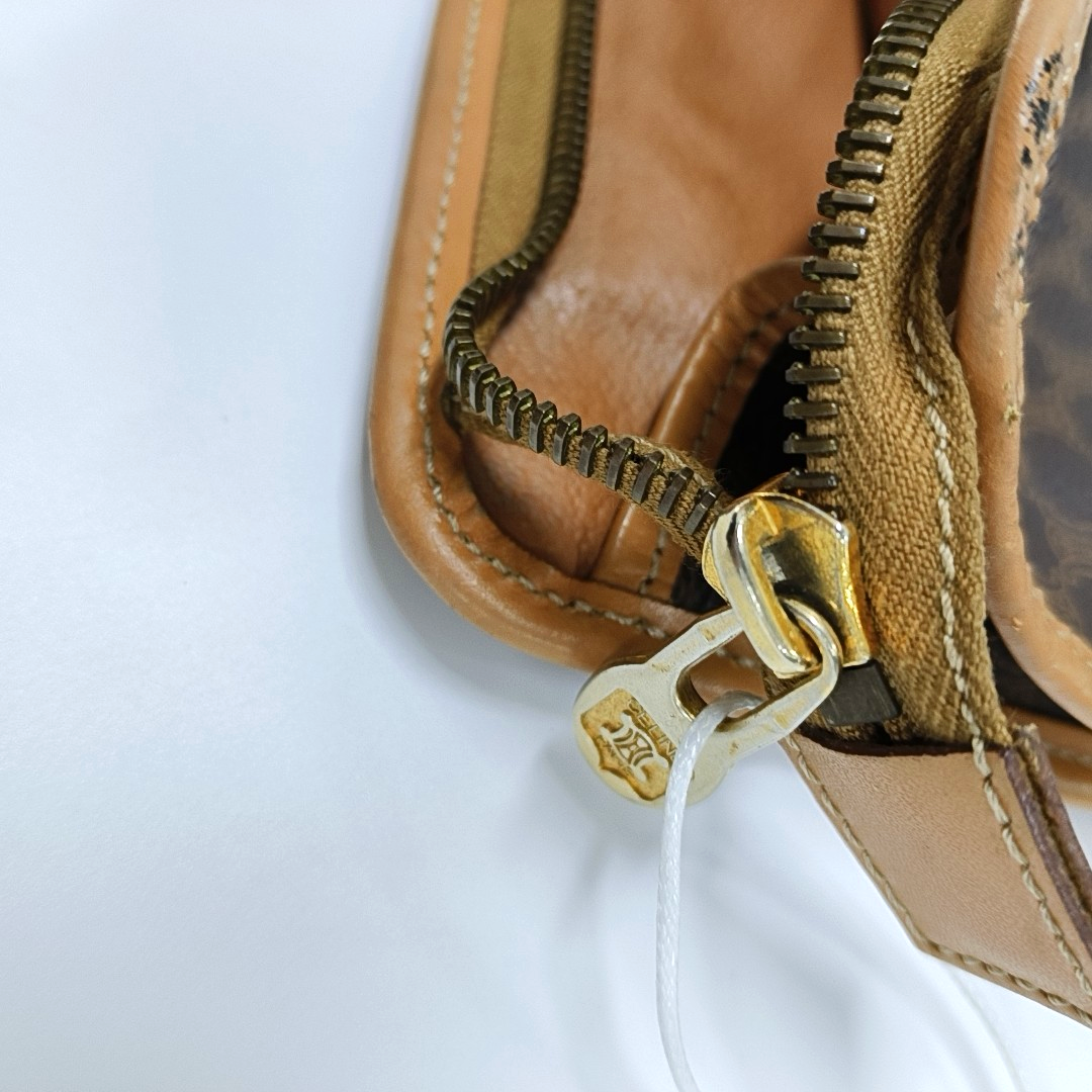 Authenticated pre-owned  MACADAM CLUTCHE Coated Canvas Brown - Clutch at Looply