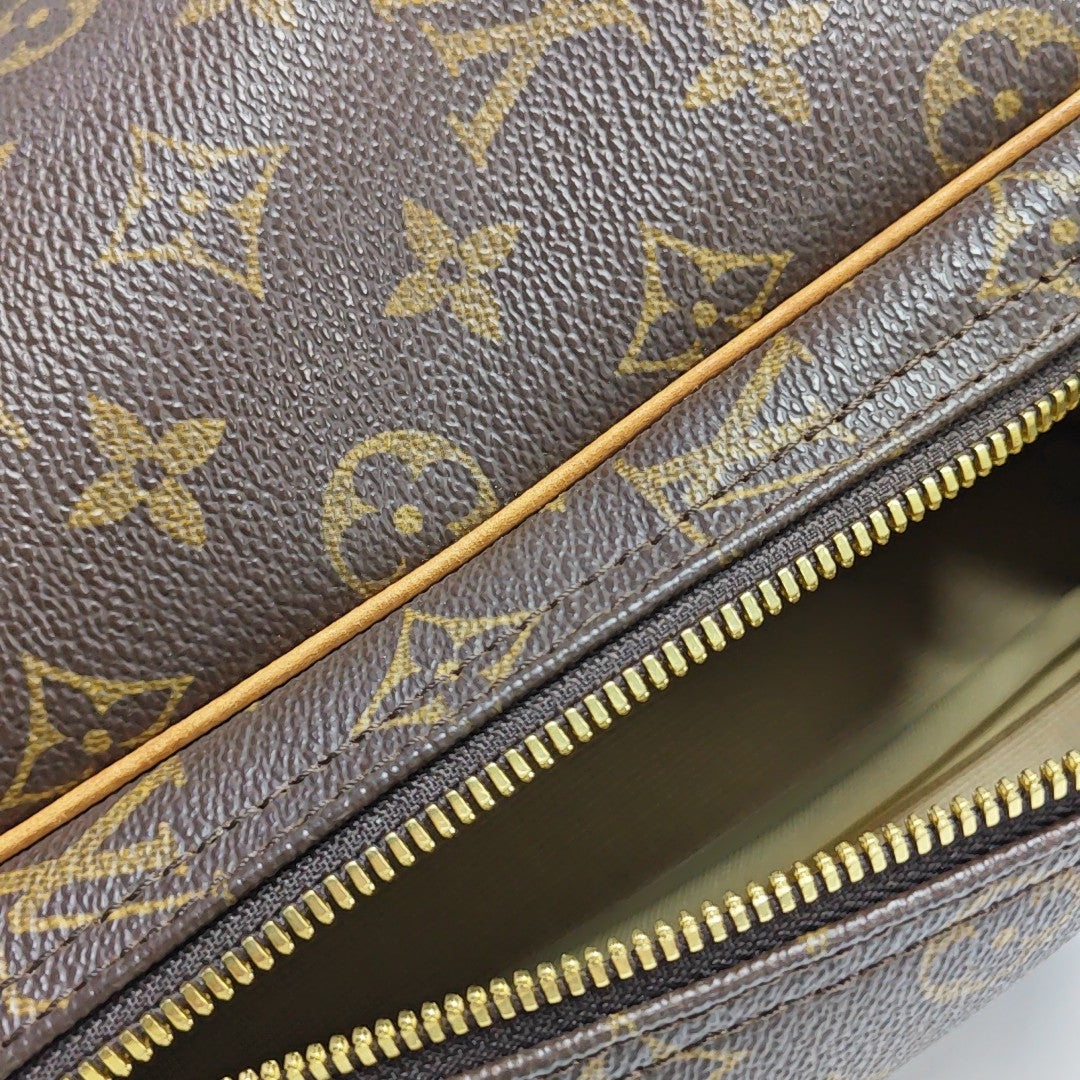 EXCURSION Monogram Coated Canvas Brown