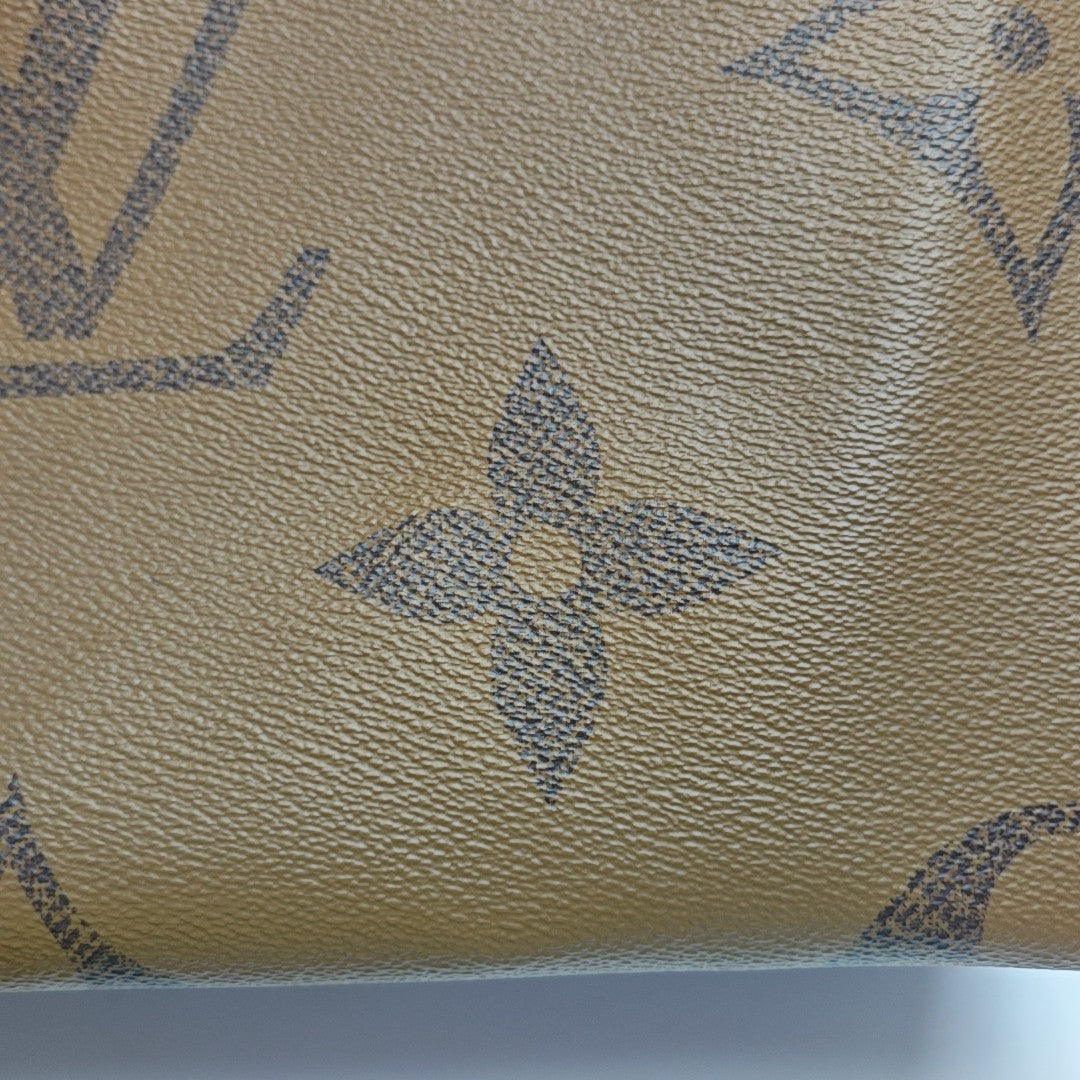 ONTHEGO MM Monogram Coated Canvas Brown
