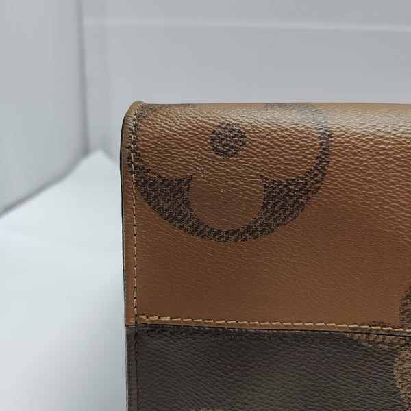 ONTHEGO MM Monogram Coated Canvas Brown