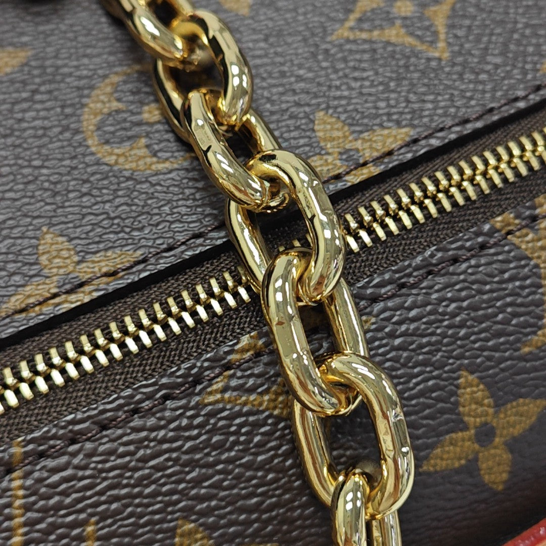 MÉTIS EAST WEST Monogram Coated Canvas Brown