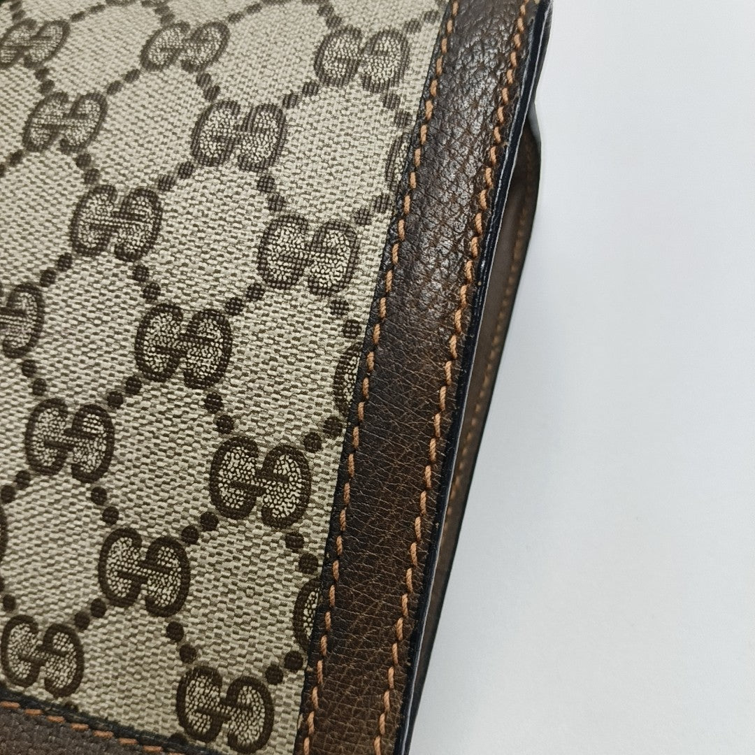 Monogram Coated Canvas Clutch Beige