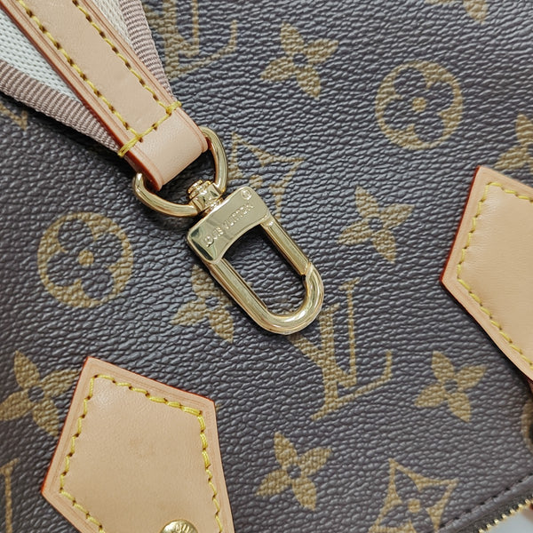 SPEEDY 20 Monogram Coated Canvas Brown