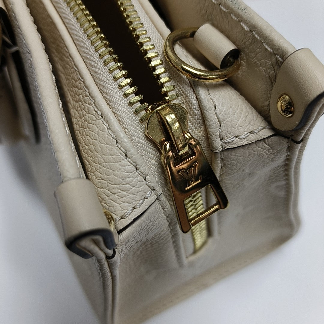 ONTHEGO EAST WEST Monogram Calfskin Beige