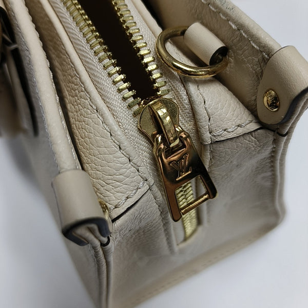 ONTHEGO EAST WEST Monogram Calfskin Beige