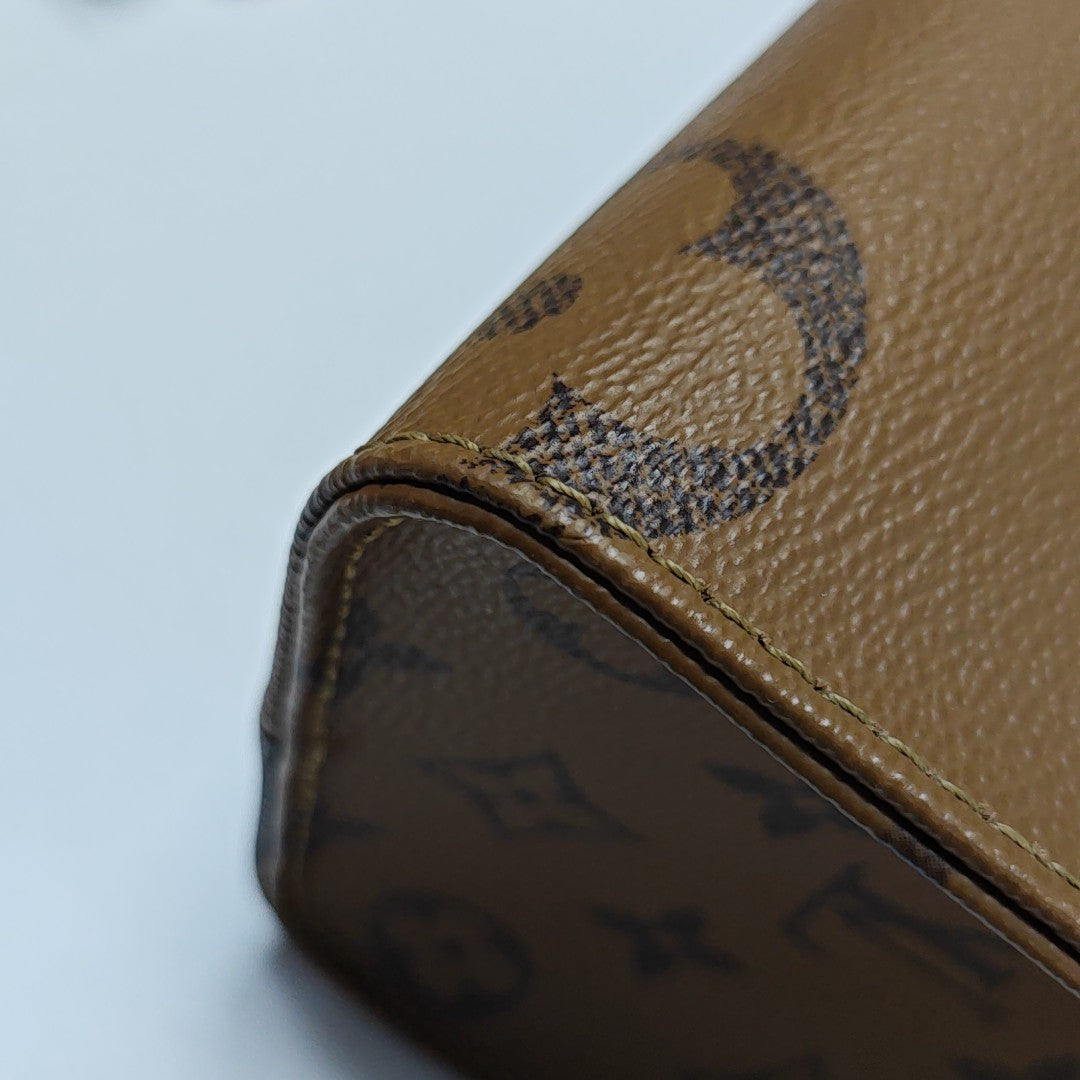ONTHEGO PM Monogram Coated Canvas Brown