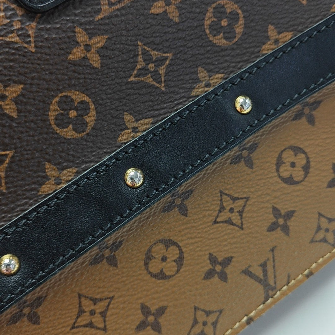 TRUNK Monogram Coated Canvas Brown