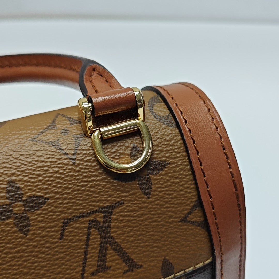 DAUPHINE Monogram Coated Canvas Brown