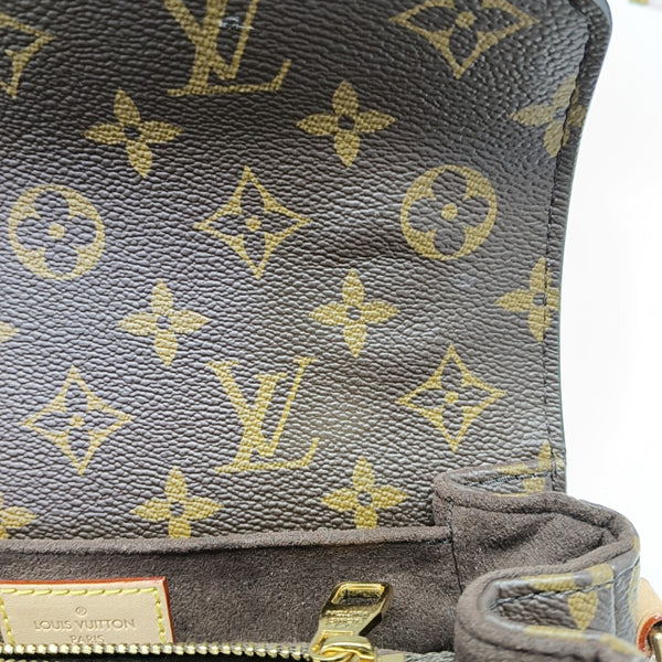 MÉTIS EAST WEST Monogram Coated Canvas Brown
