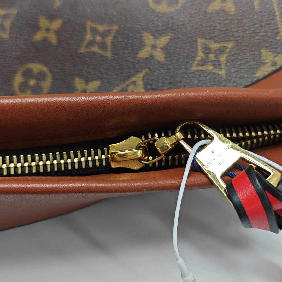 TUILERIES Monogram Coated Canvas Brown