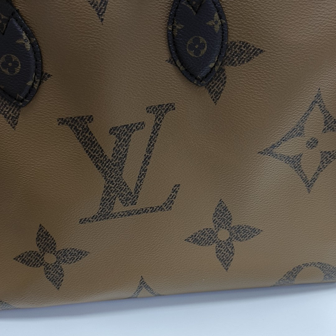 ONTHEGO MM Monogram Coated Canvas Brown