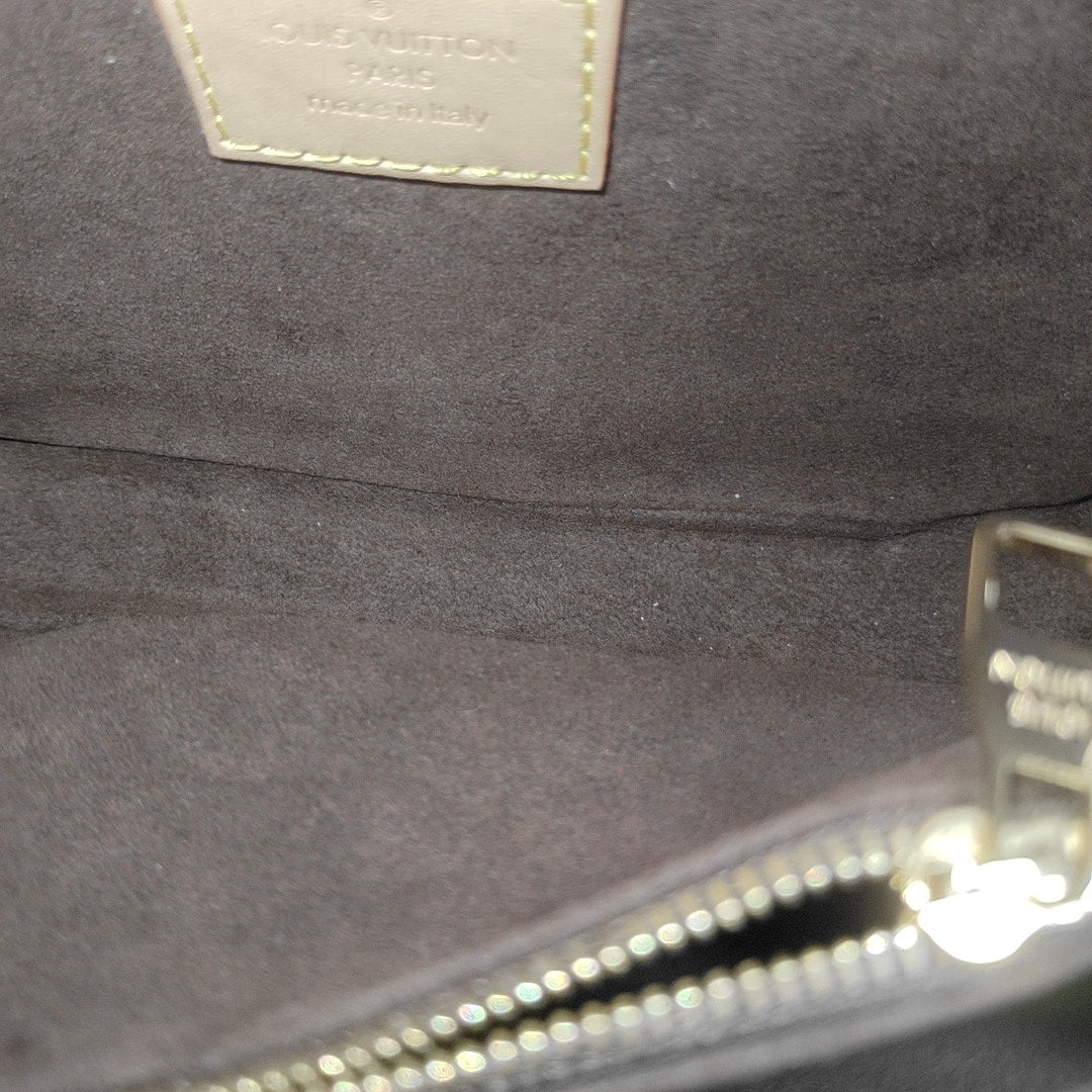 MÉTIS EAST WEST Monogram Coated Canvas Brown