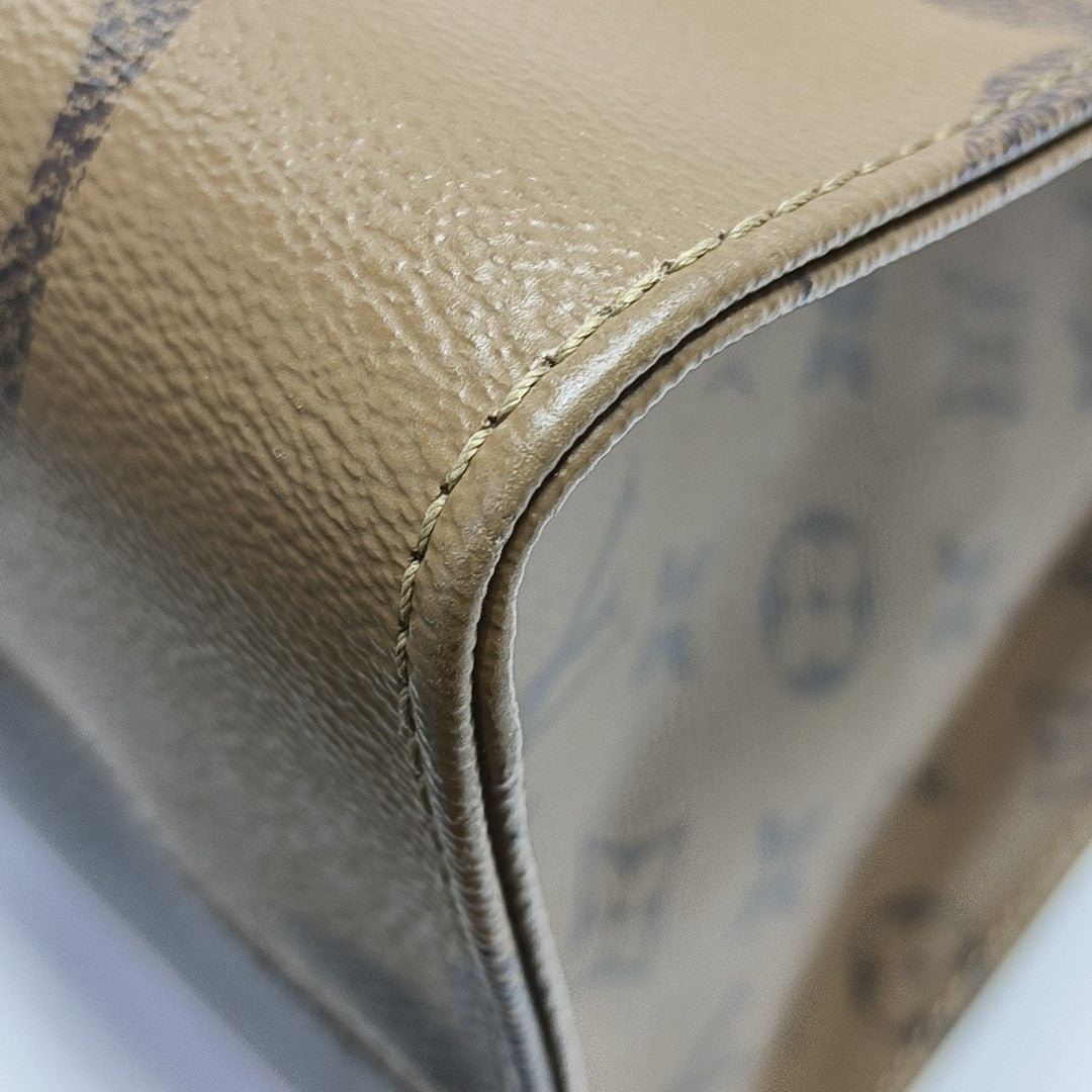 ONTHEGO GM Monogram Coated Canvas Brown