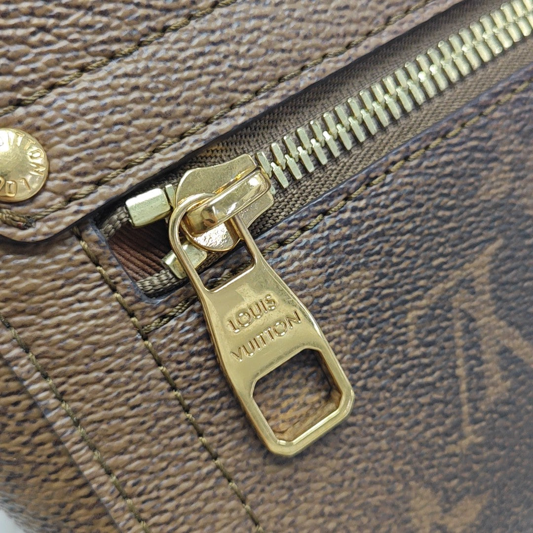 TRUNK Monogram Coated Canvas Brown