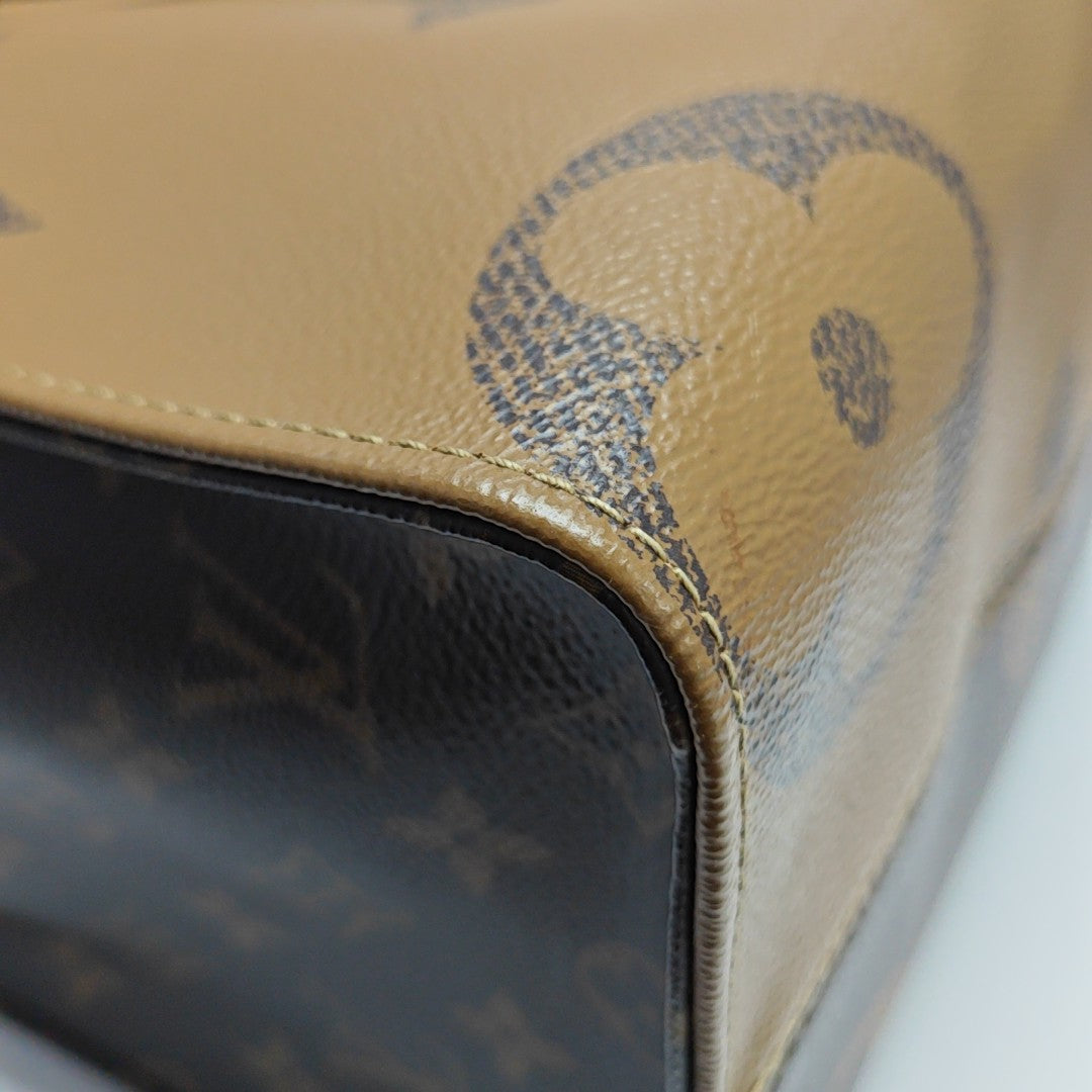 ONTHEGO MM Monogram Coated Canvas Brown