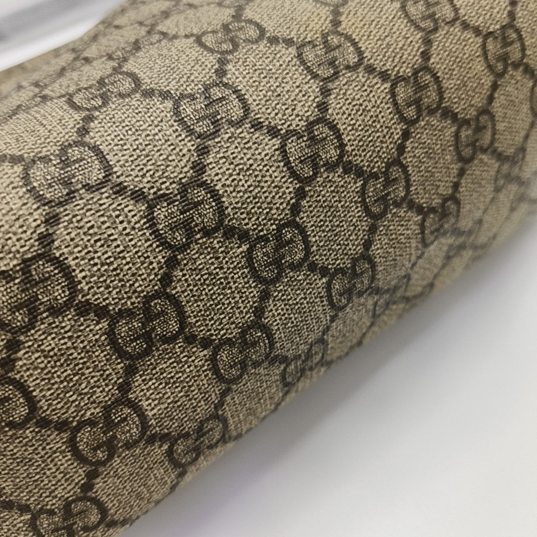 Monogram Coated Canvas Clutch Brown
