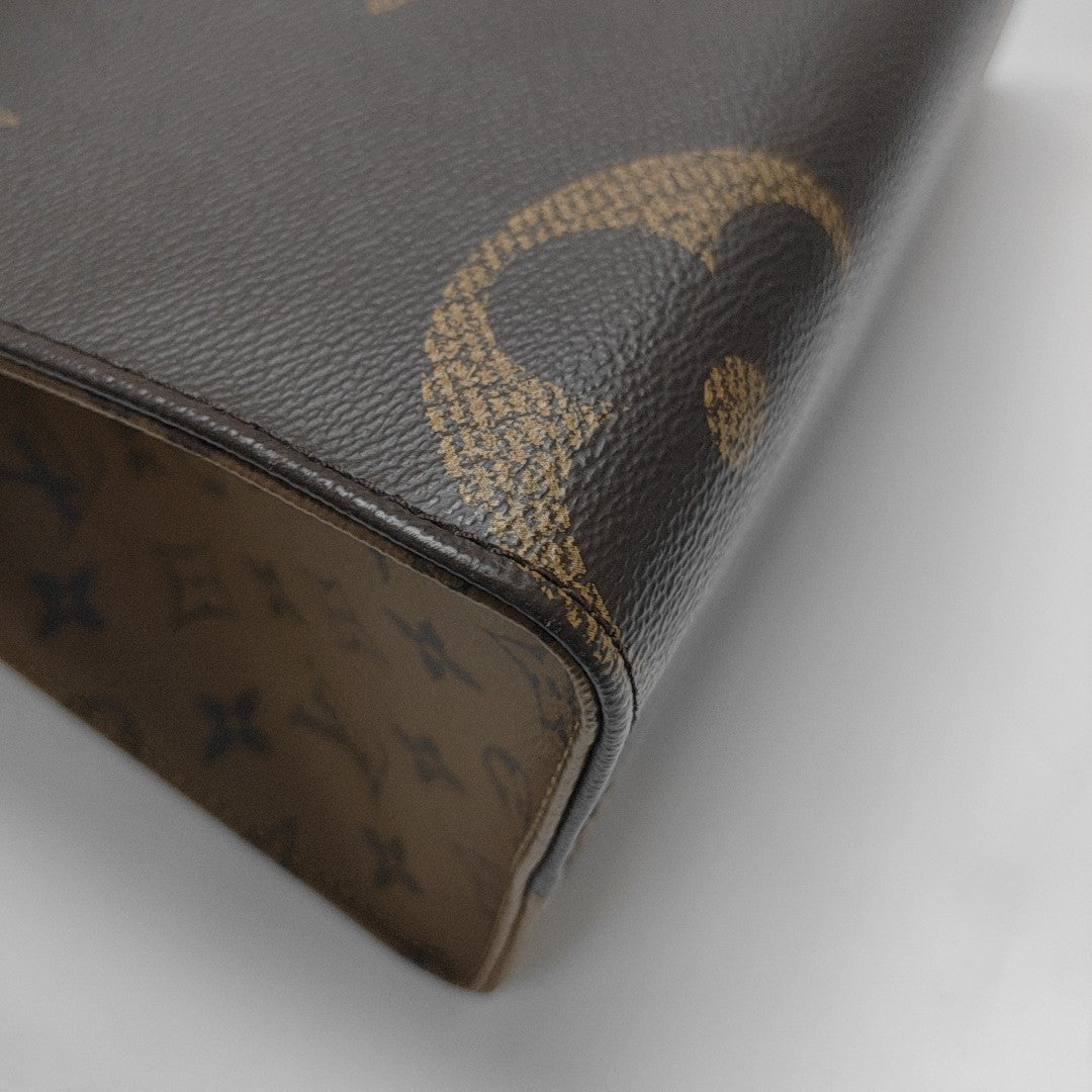 ONTHEGO MM Monogram Coated Canvas Brown
