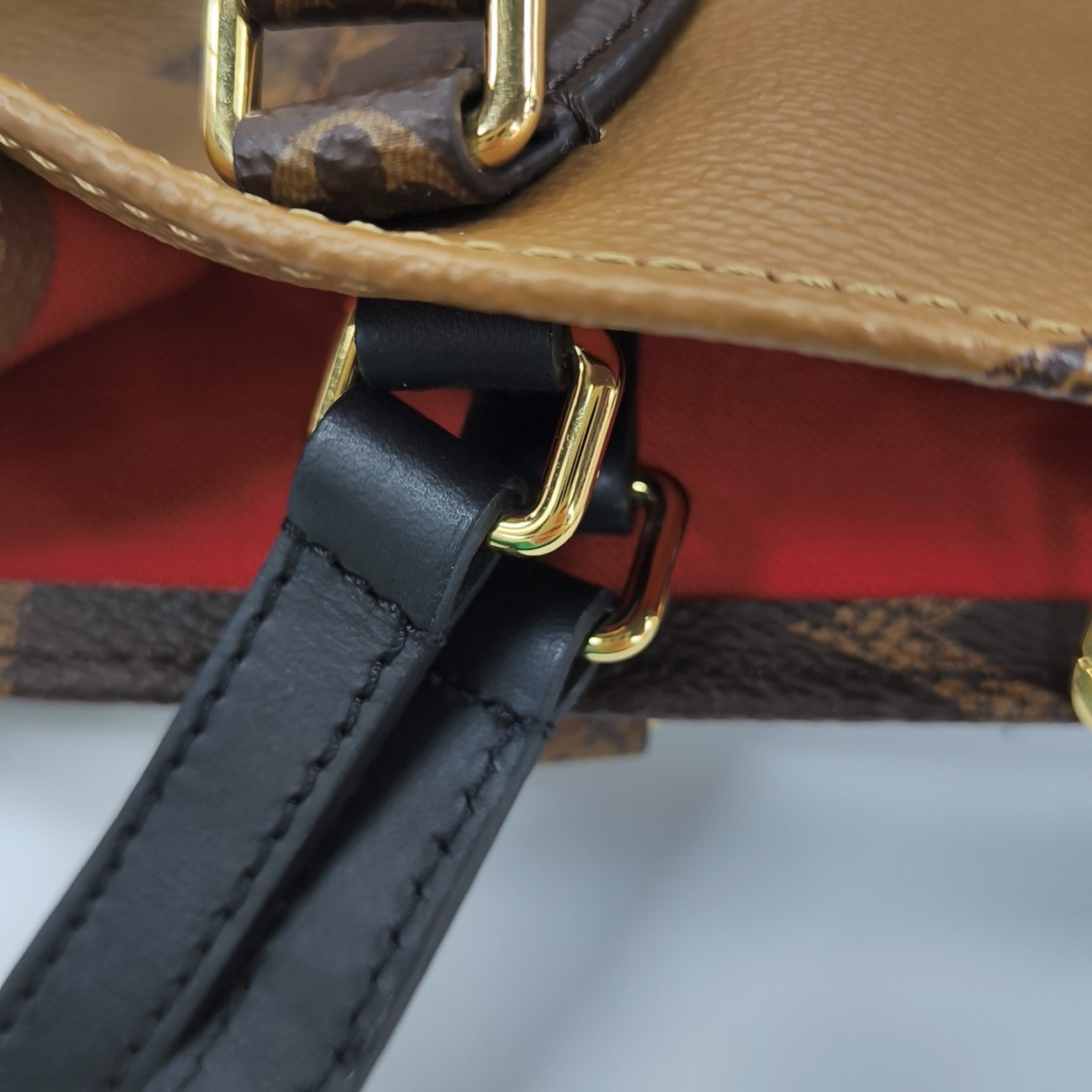 ONTHEGO MM Monogram Coated Canvas Brown