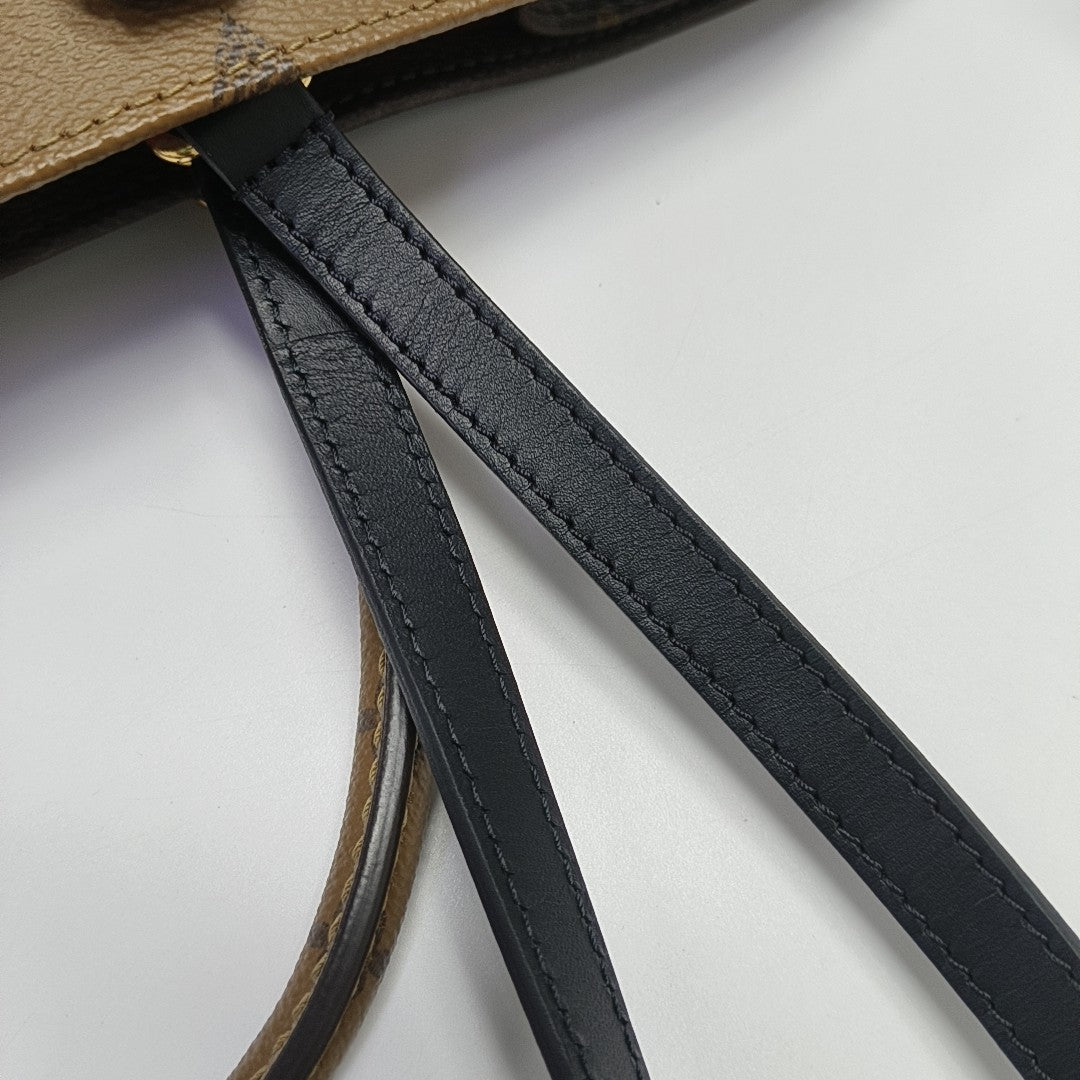 ONTHEGO GM Monogram Coated Canvas Brown