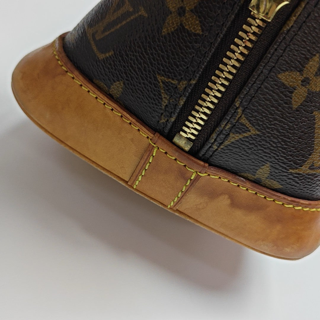 ALMA PM Monogram Coated Canvas Brown