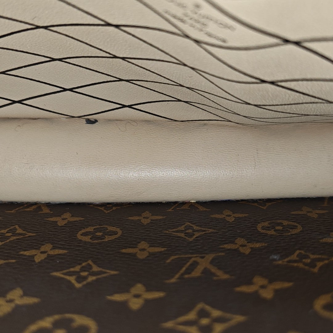 TRUNK Monogram Coated Canvas Brown
