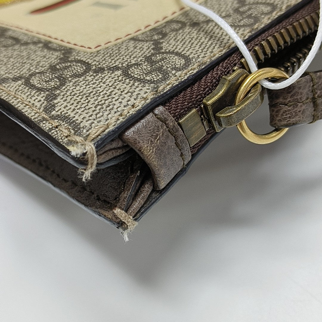 Monogram Coated Canvas Clutch Beige