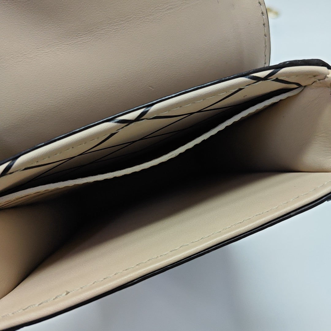 TRUNK Monogram Coated Canvas Brown