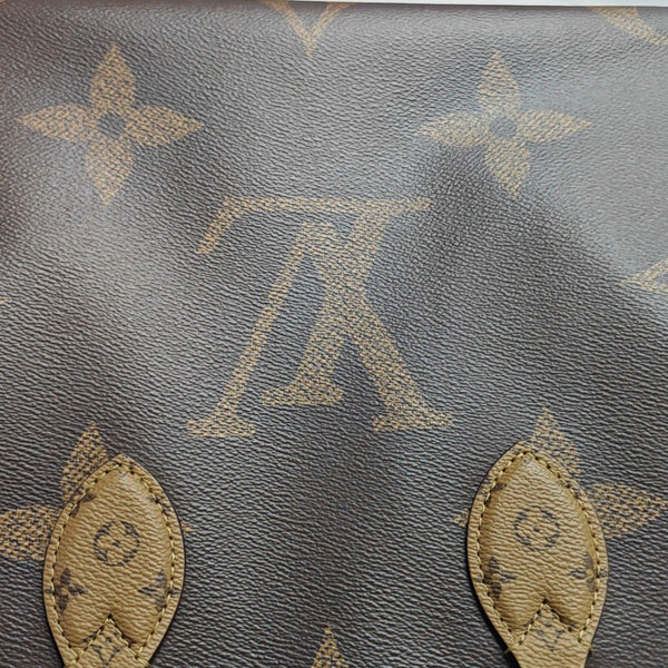 ONTHEGO MM Monogram Coated Canvas Brown