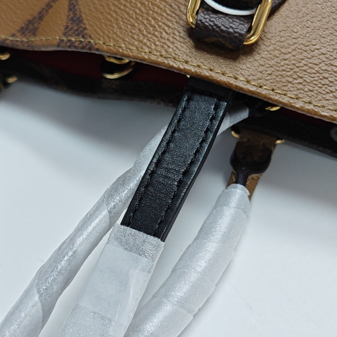 ONTHEGO MM Monogram Coated Canvas Brown
