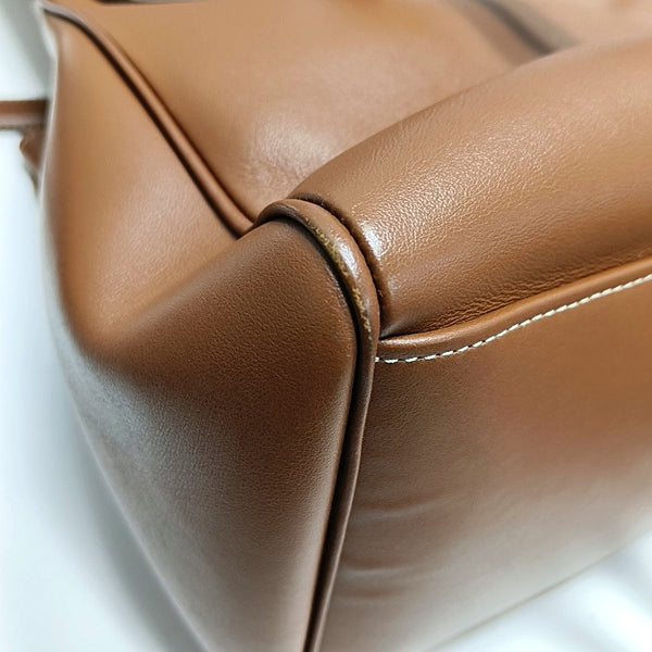 Authenticated pre-owned  16 Medium Calfskin Brown - Top Handle Bag at Looply