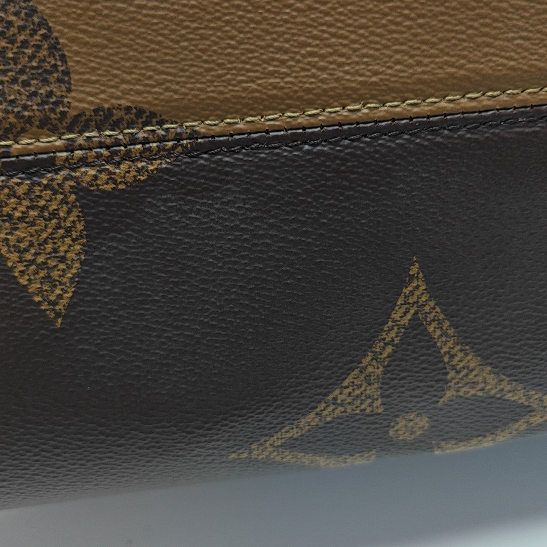 ONTHEGO MM Monogram Coated Canvas Brown