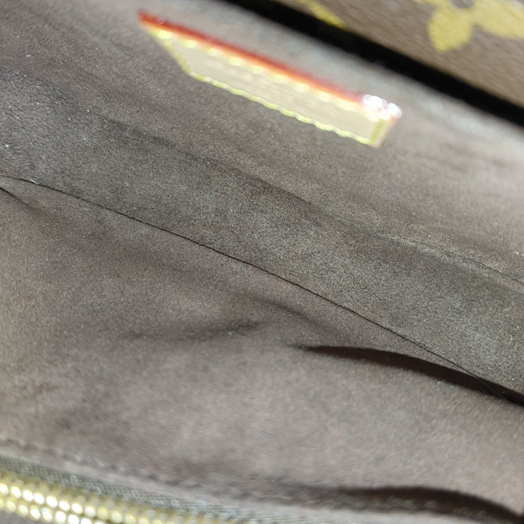 MÉTIS EAST WEST Monogram Coated Canvas Brown