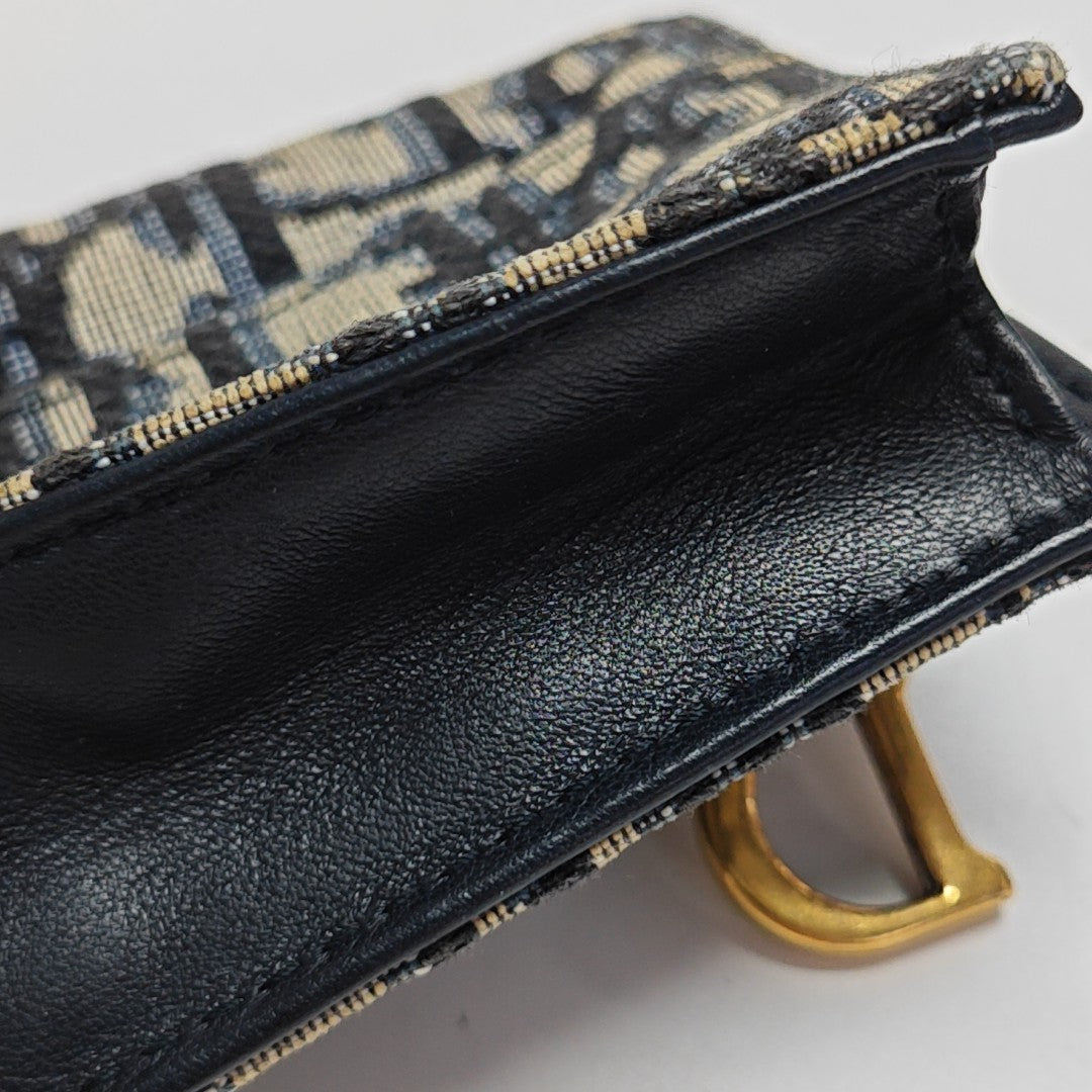 Authenticated pre-owned  Saddle Monogram Fabric Blue Card Holder - Card Holder at Looply