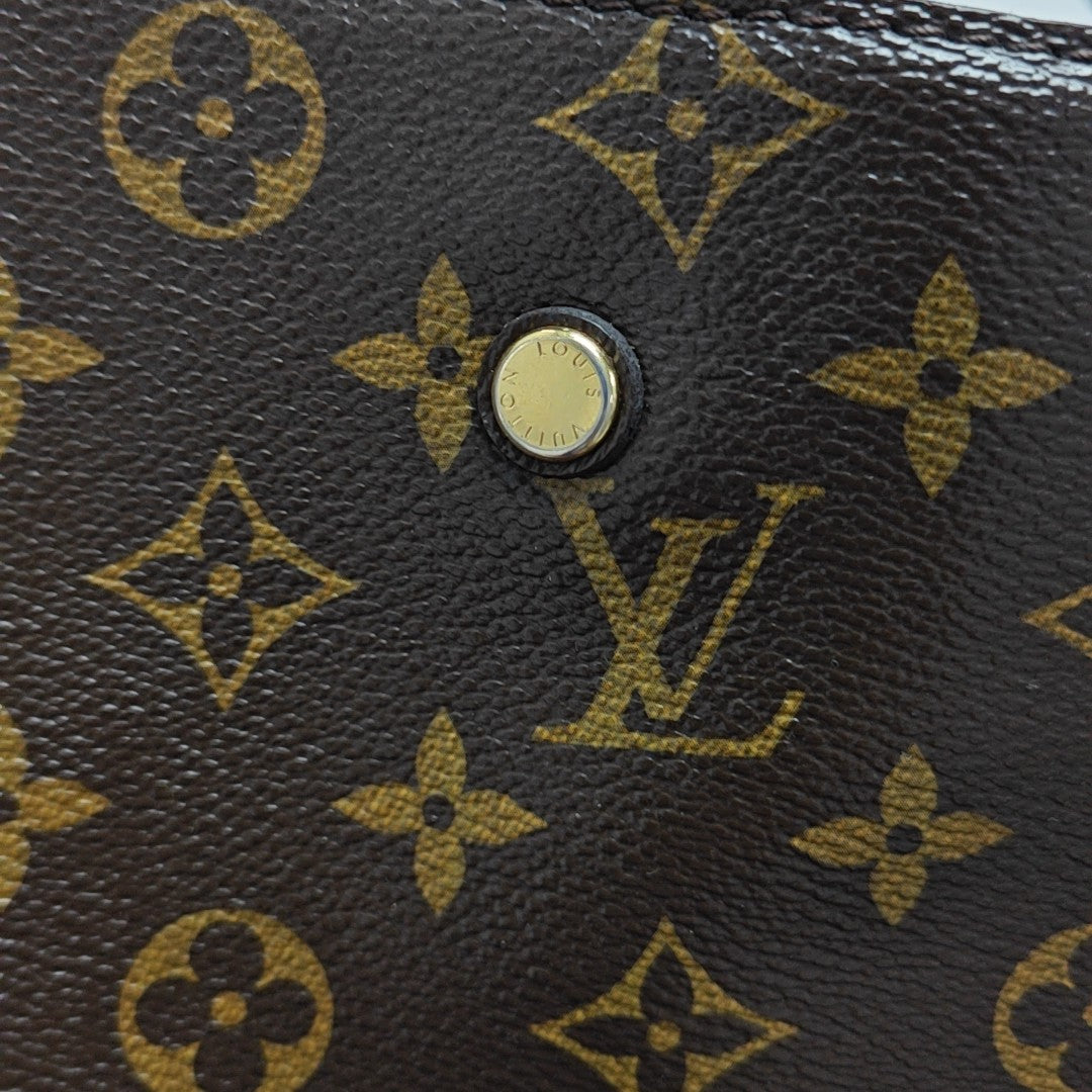 MONTAIGNE GM Monogram Coated Canvas Brown