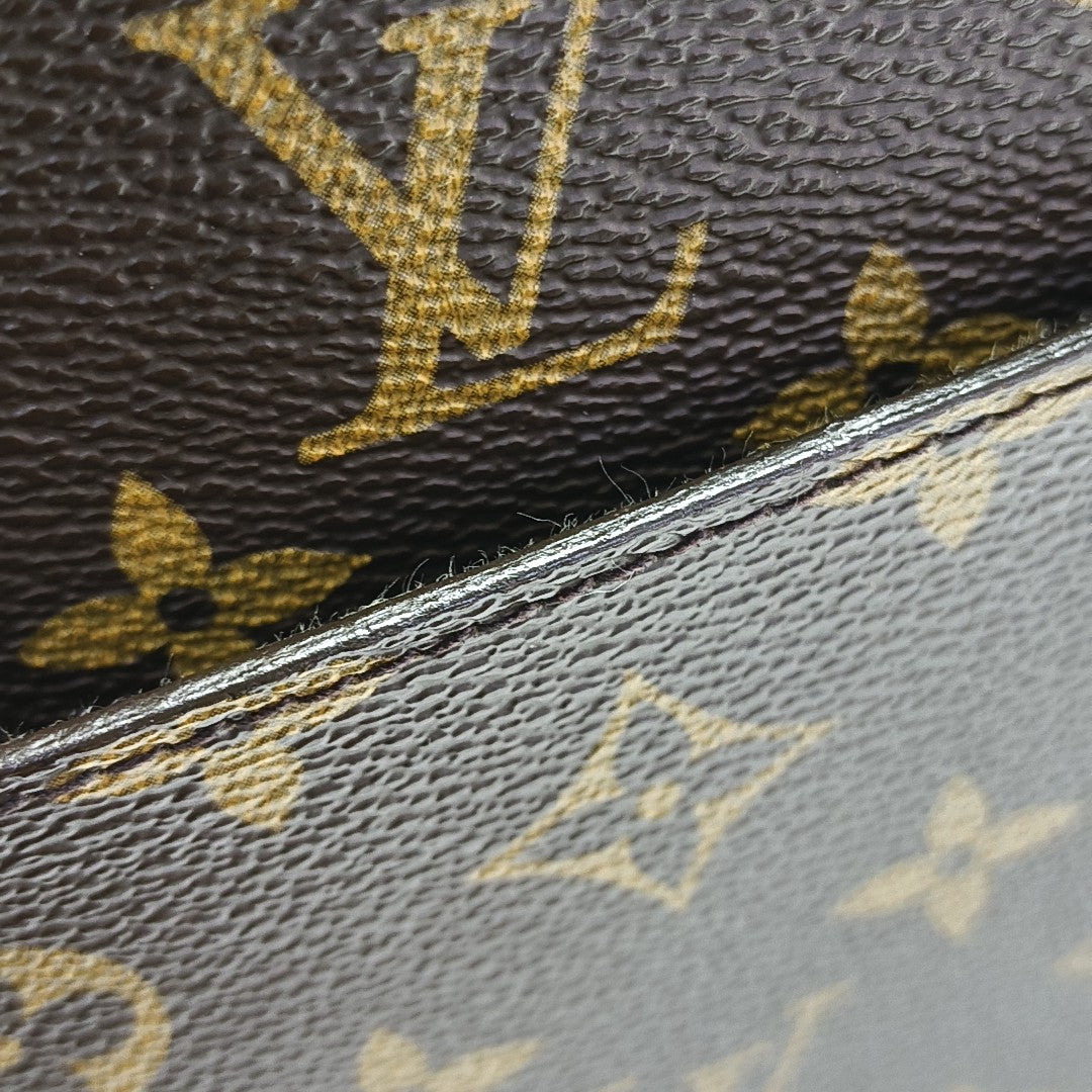 Monogram Coated Canvas Clutch Brown