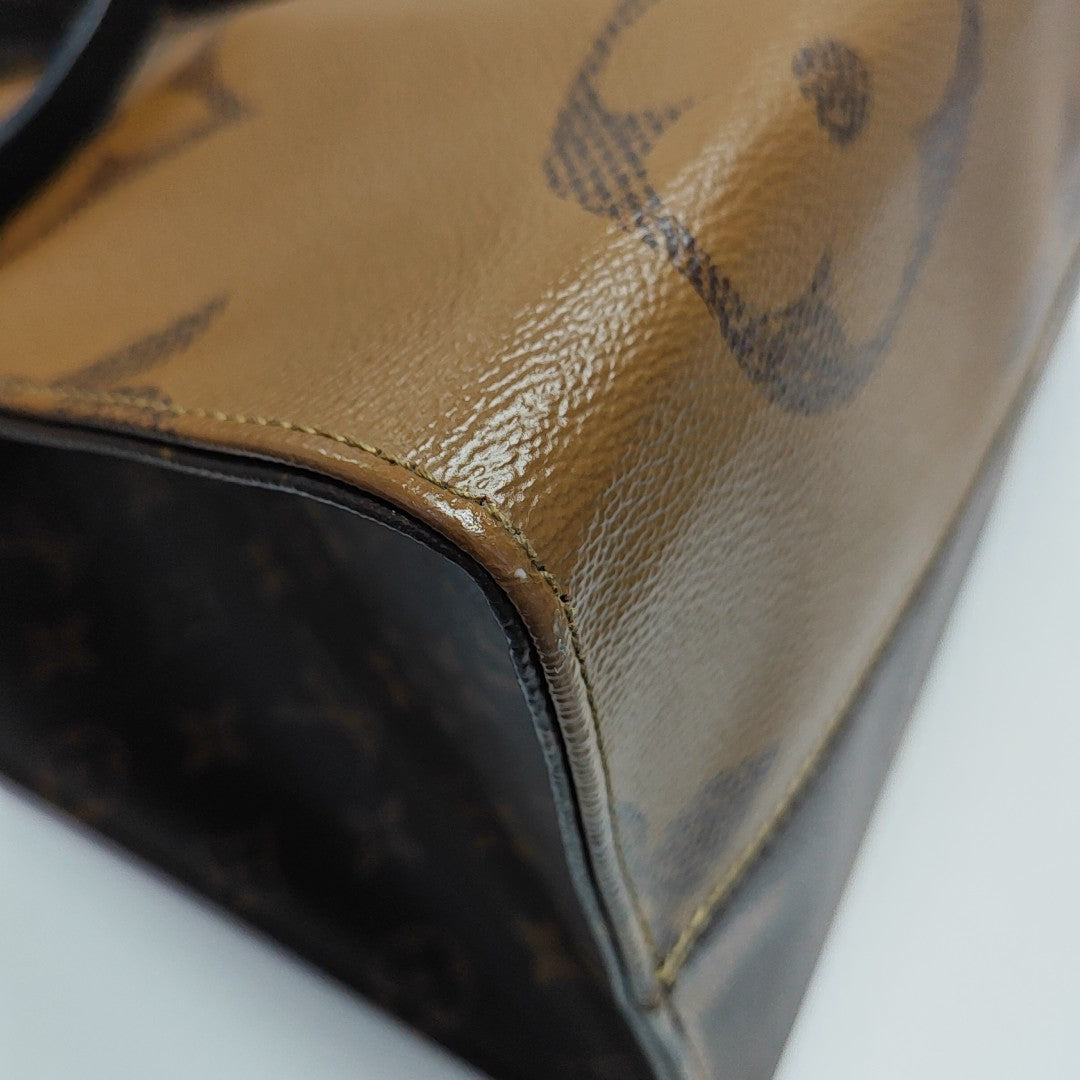 ONTHEGO GM Monogram Coated Canvas Brown