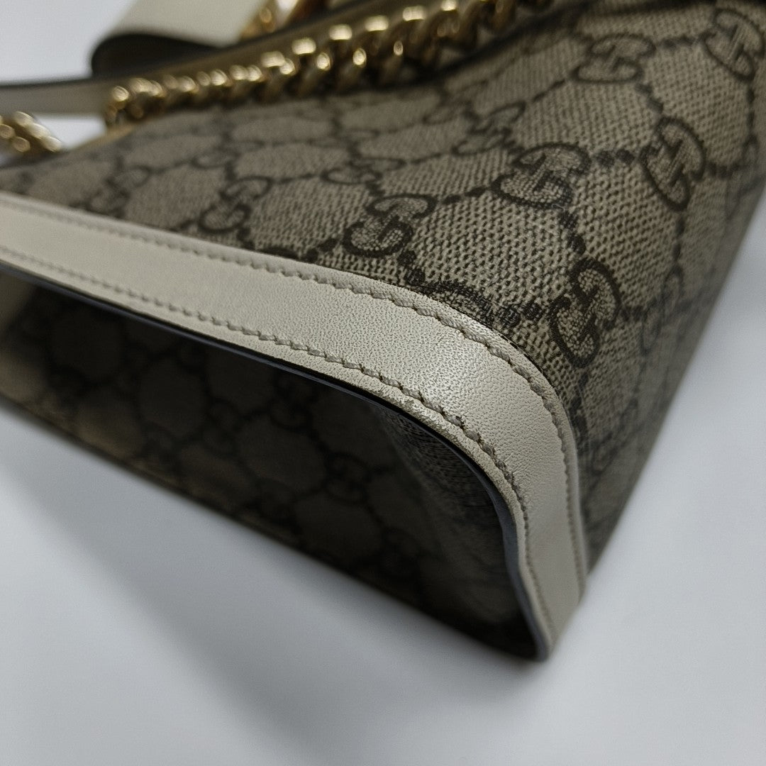 Padlock Small Monogram Coated Canvas Beige