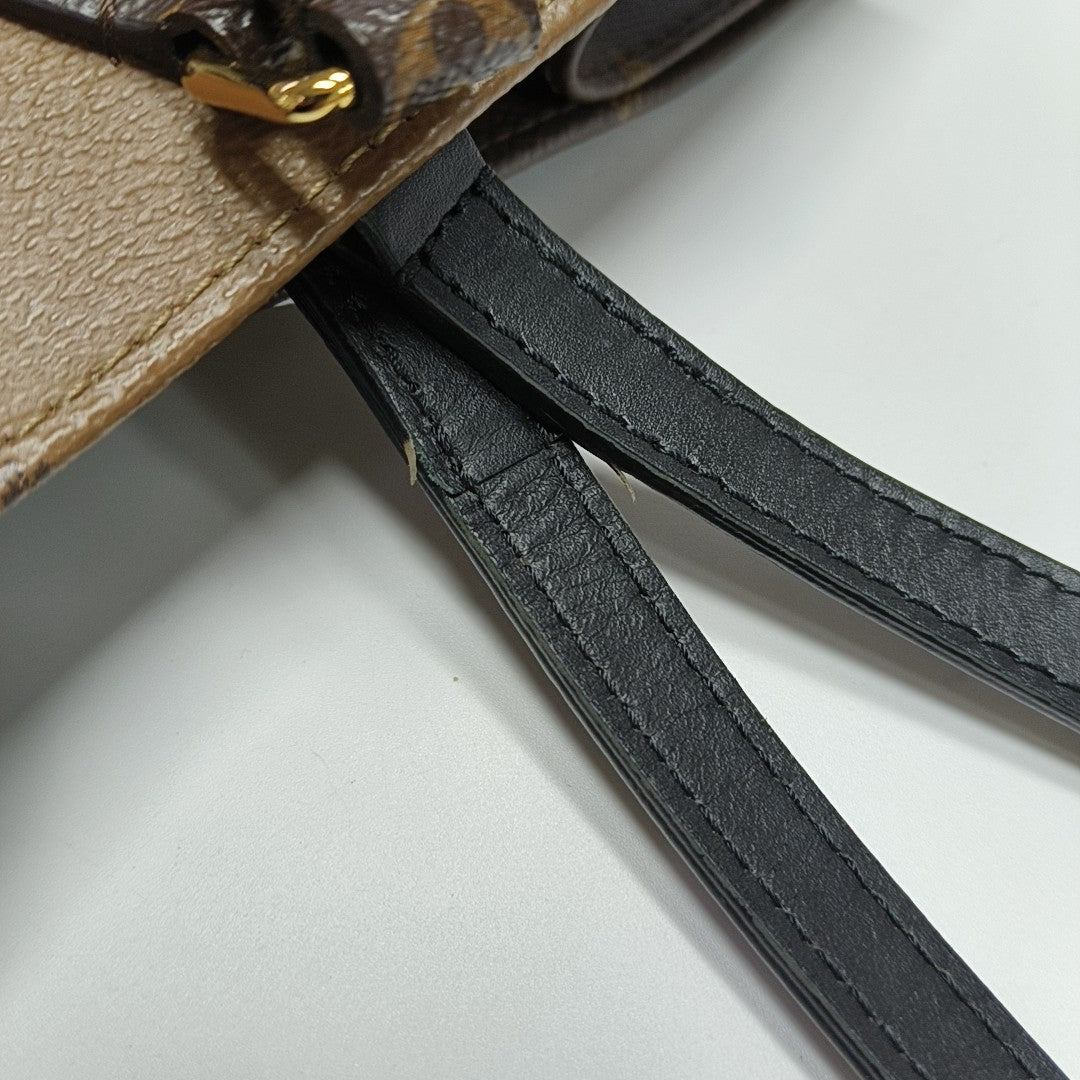 ONTHEGO MM Monogram Coated Canvas Brown