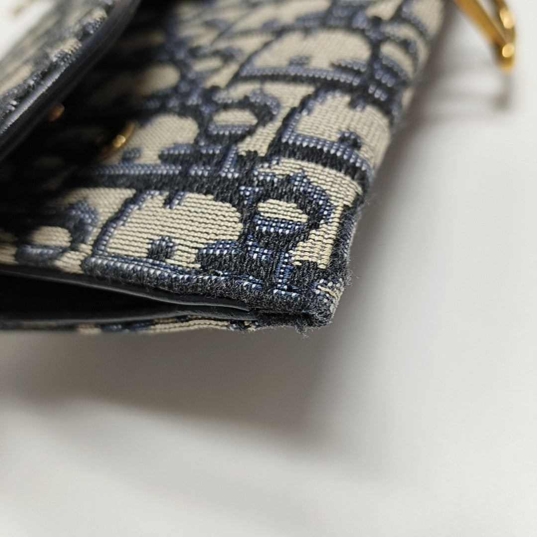 Authenticated pre-owned  Saddle Small Oblique Canvas Blue - Crossbody Bag at Looply